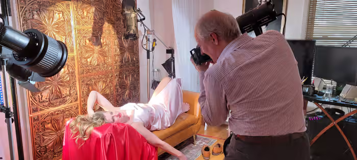 Behind the scenes shot of Paolo creating boudoir portraits for a client.